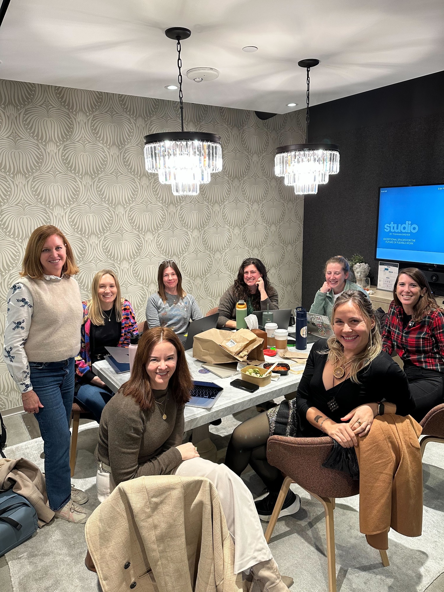 Members coworking together around a table