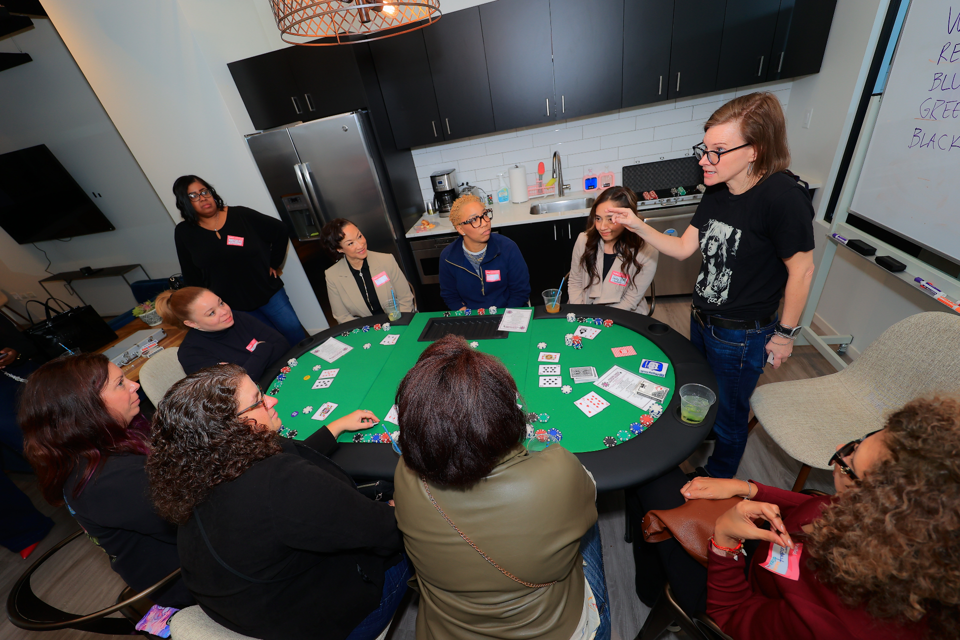 Manifest and Mingle attendees gathered around a game table